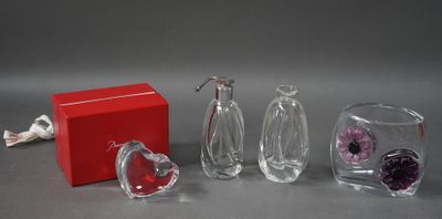 three glass vases and a red box on the table