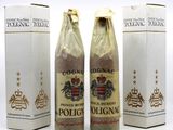 three bottles of wine sitting next to each other on a white surface