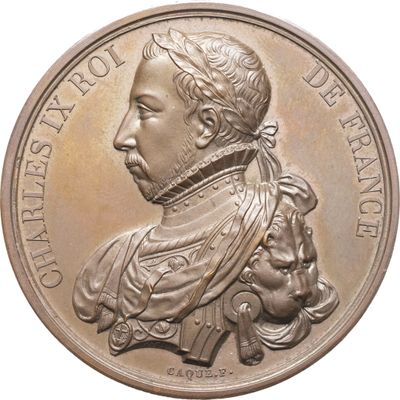 une image représentant une médaille de bronze sur laquelle figurent le portrait d'un homme et d'un chien
