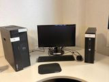 a computer desk with a monitor, keyboard, mouse and monitor on it