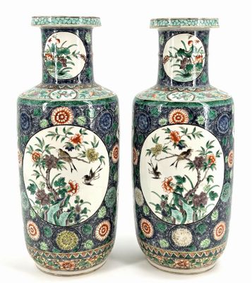 pair of chinese vases with birds and flowers painted on them