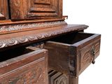 a wooden cabinet with a drawer on top of it