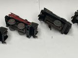 many toy trains that are hanging on the wall