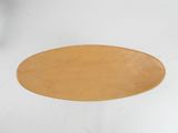 a wooden plate that is sitting on a white table