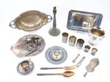 a lot of silver items that are on the table