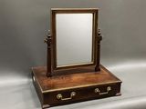 an image of a wooden vanity mirror with a drawer underneath it