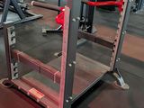 an image of a gym room with a row of exercise equipment