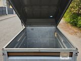 the back end of a trailer with the open door open