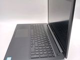 a laptop that is open on a white table