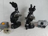 two microscopes that are sitting next to each other
