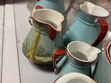 many different types of vases and bowls on the table