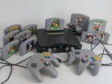 several video game controllers are sitting next to each other on a table