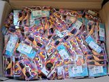 a cardboard box filled with lots of different colored items