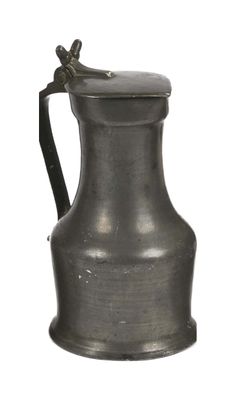 a small metal pitcher with a handle on a white background
