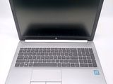 a laptop computer that is sitting on a white table