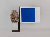 an image of a sculpture of a tree with a blue square in the background