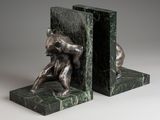 marble bookends with a bronze sculpture of a bear and a bear cub