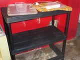 a black table with a tray on top of it