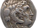 une vieille pièce d'argent sur laquelle figure une femme à cheval