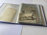 an open book with a picture inside of it on a table