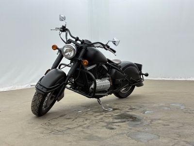a black motorcycle that is parked in a parking lot