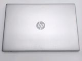 hp laptop computer sitting on a table with a white background