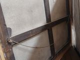 an old window in the corner of a room that needs to be replaced