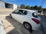 a picture of a white car parked in a parking lot