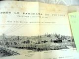an old book with a picture of a town on it
