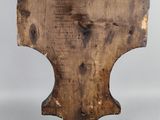 an old wooden table with a measuring scale on top of it