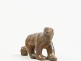 statue of a brown bear on a white background
