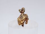 leopard figurine sitting on top of a clear glass