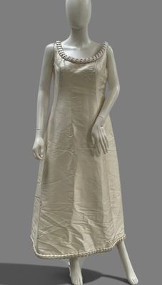 an image of a mannequin wearing a white dress with a beaded neckline