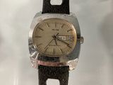 an image of a close up of a wrist watch on a table