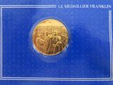 a close up of a gold coin on a blue background