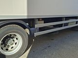 a white truck that is parked on the side of the road