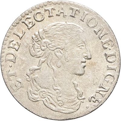 a silver coin with a woman ' s face on it