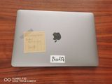 a sticker on the back of an apple laptop