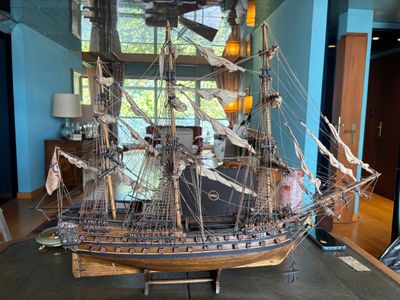 a model of a ship that is on display in a room