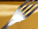 a fork that has a piece of cake on it