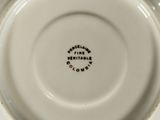 a close up of a white plate with black writing on it