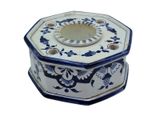 a blue and white octagonal box with a flower design on it