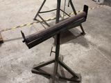 a machine that is sitting on a stand in a warehouse
