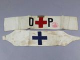 two white and blue medical sashes with a red cross on them