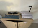 a desk with a printer and a printer on top of it