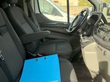 a blue folder sitting in the passenger seat of a van