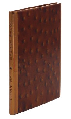 un vieux livre avec une couverture marron parsemée de petits points marron