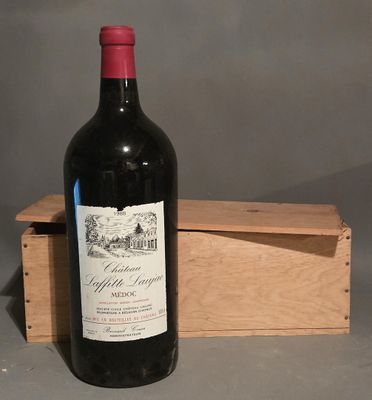 a bottle of wine that is sitting in a wooden box