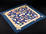 an image of a blue table cloth with sushi on it