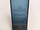 the back of a black phone with a keypad on the display